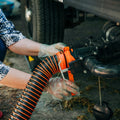 RV Owner Installing Orange RhinoEXTREME Sewer Hose with Gloves | United RV Parts