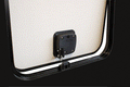 Black Rotary Pro Baggage Latch BLL-60301 Installed on RV Compartment Door - Interior Latch View | United RV Parts