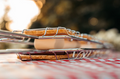 S'Mores Loaded in Chrome Grill Basket on Checkered Tablecloth - Lifestyle Detail | United RV Parts