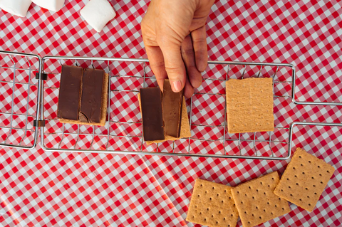 Loading Graham Crackers and Chocolate into S'Mores Grill Basket - Easy Assembly | United RV Parts