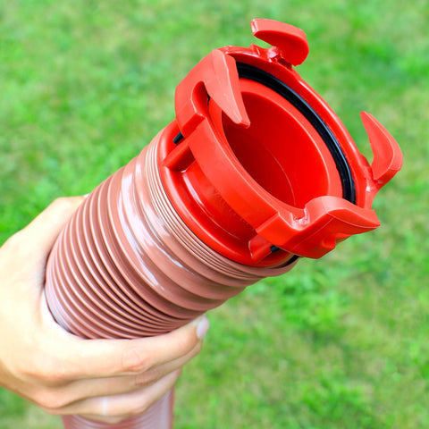 Hand Holding Red Valterra EZ Coupler RV Sewer Hose Adapter - Bayonet Lock Detail Close-Up | United RV Parts
