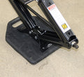 Black Plastic RV Base Pad Supporting Scissor Jack Stabilizer on Concrete - Side Angle | United RV Parts