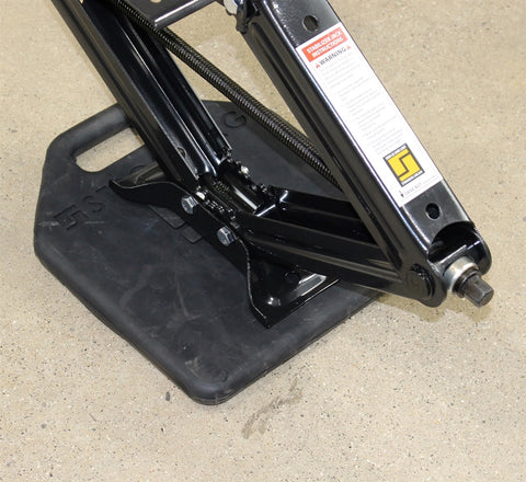 Black Plastic RV Base Pad Supporting Scissor Jack Stabilizer on Concrete - Side Angle | United RV Parts