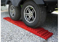 Red Valterra StayPut RV Leveling Stackers Under Trailer Tire - In-Use Scene | United RV Parts