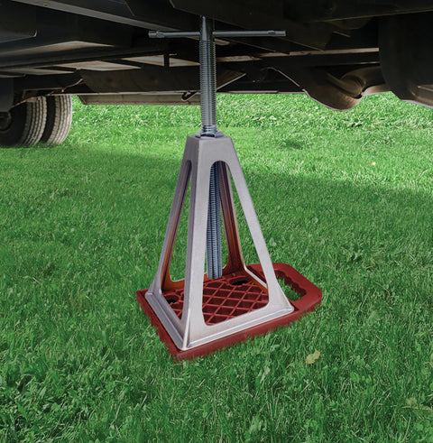 Valterra StayPut RV Stabilizer Jack Pad In Use Under RV on Grass - Side View | United RV Parts