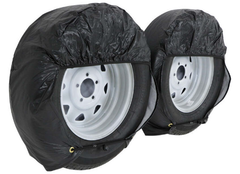 ADCO Ultra Tyre Gard Black Wheel Covers Installed on Two RV Tires - Side Angle | United RV Parts