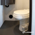 Lippert Flow Max RV Toilet Installed in Modern RV Bathroom | United RV Parts