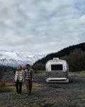 AIRSKIRTS Inflatable RV Skirt Kit on Airstream Trailer - Rear Lifestyle View in Mountains | United RV Parts